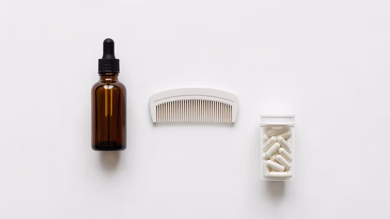 Various hair restoration treatment options laid out on a surface