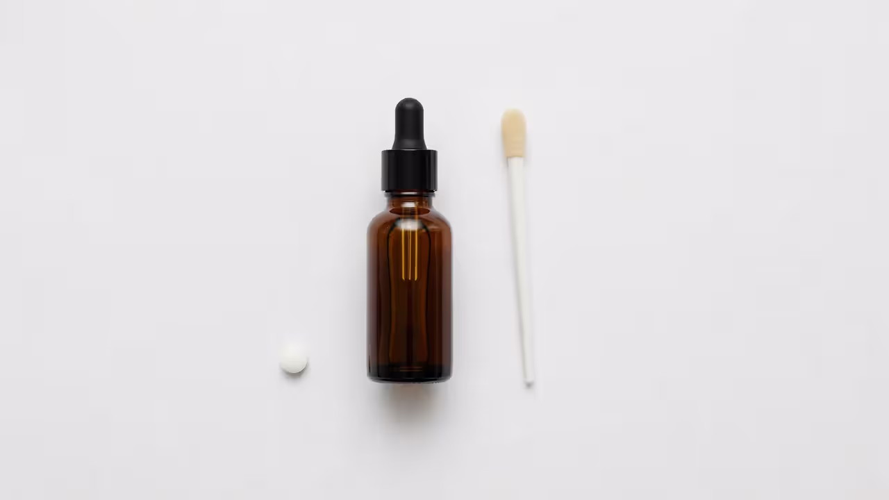 Various hair loss treatment products for men laid out on a flat surface