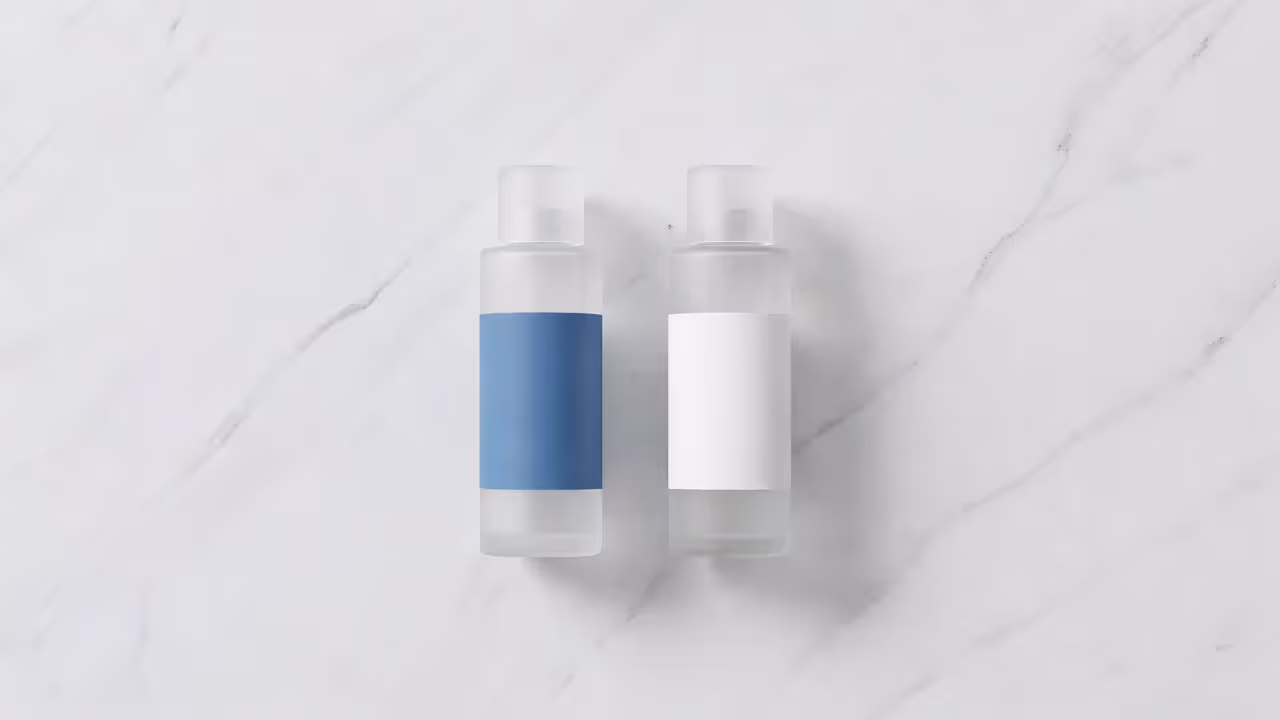 Niacinamide and salicylic acid skincare products on marble surface